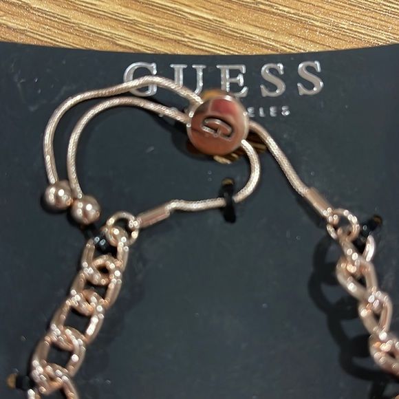 Guess gold plated bracelet with charms - Picture 2 of 3